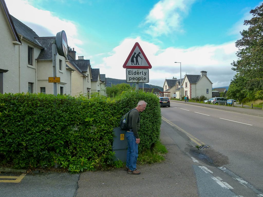 old person and sign