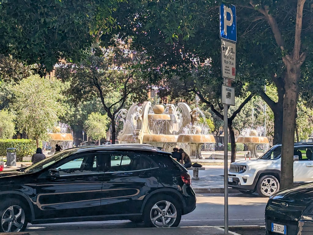 car and modern fountain