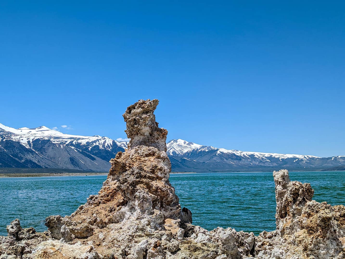 tufa against lake and mountains