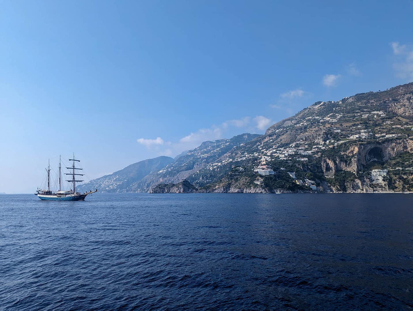 coast with multimasted ship