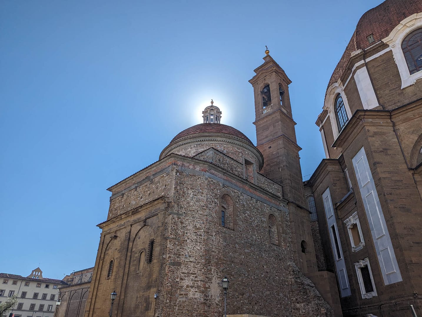 sun behind dome