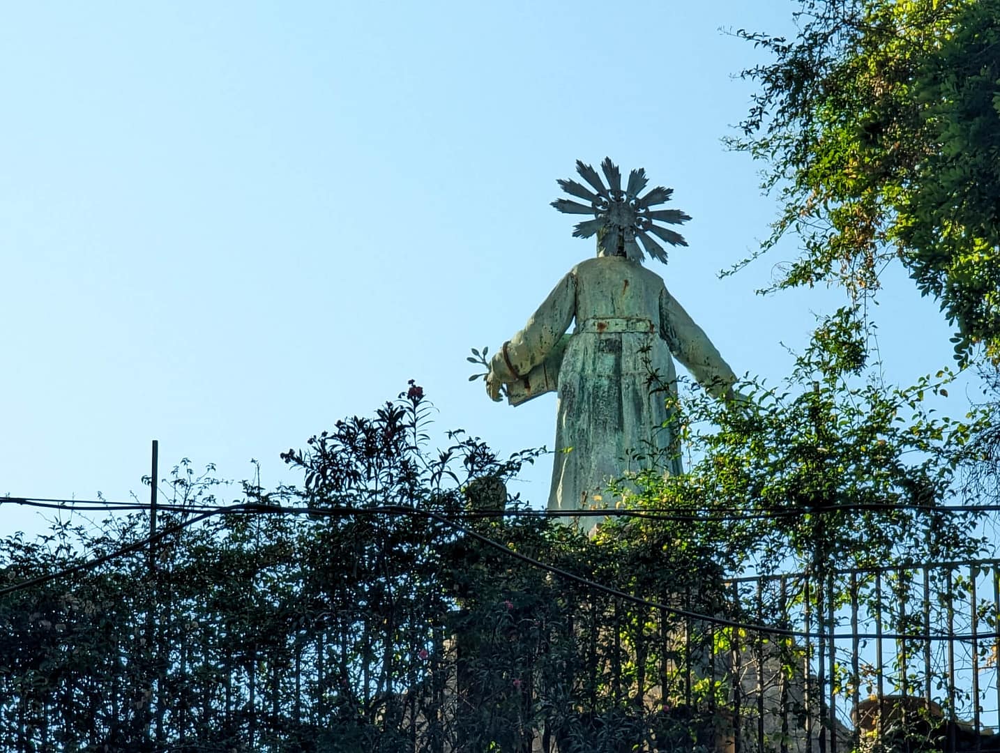 statue silhouetted against the sky