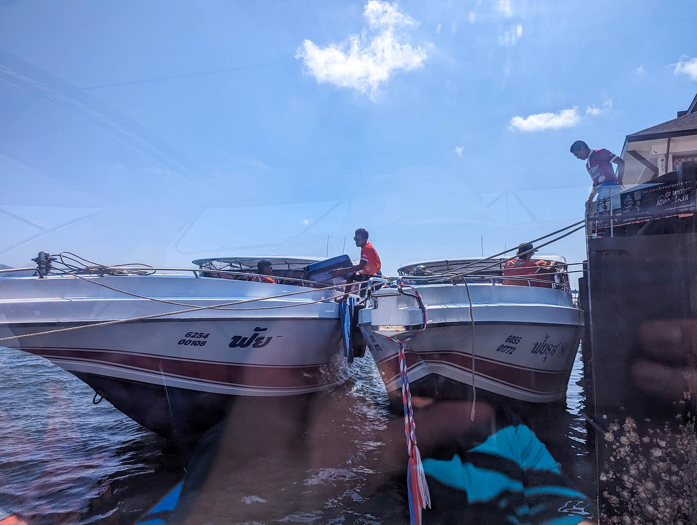 speedboats side by side
