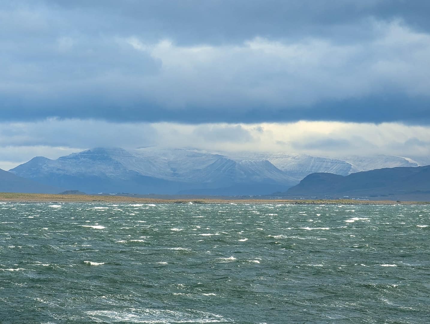 snowy mountains across water