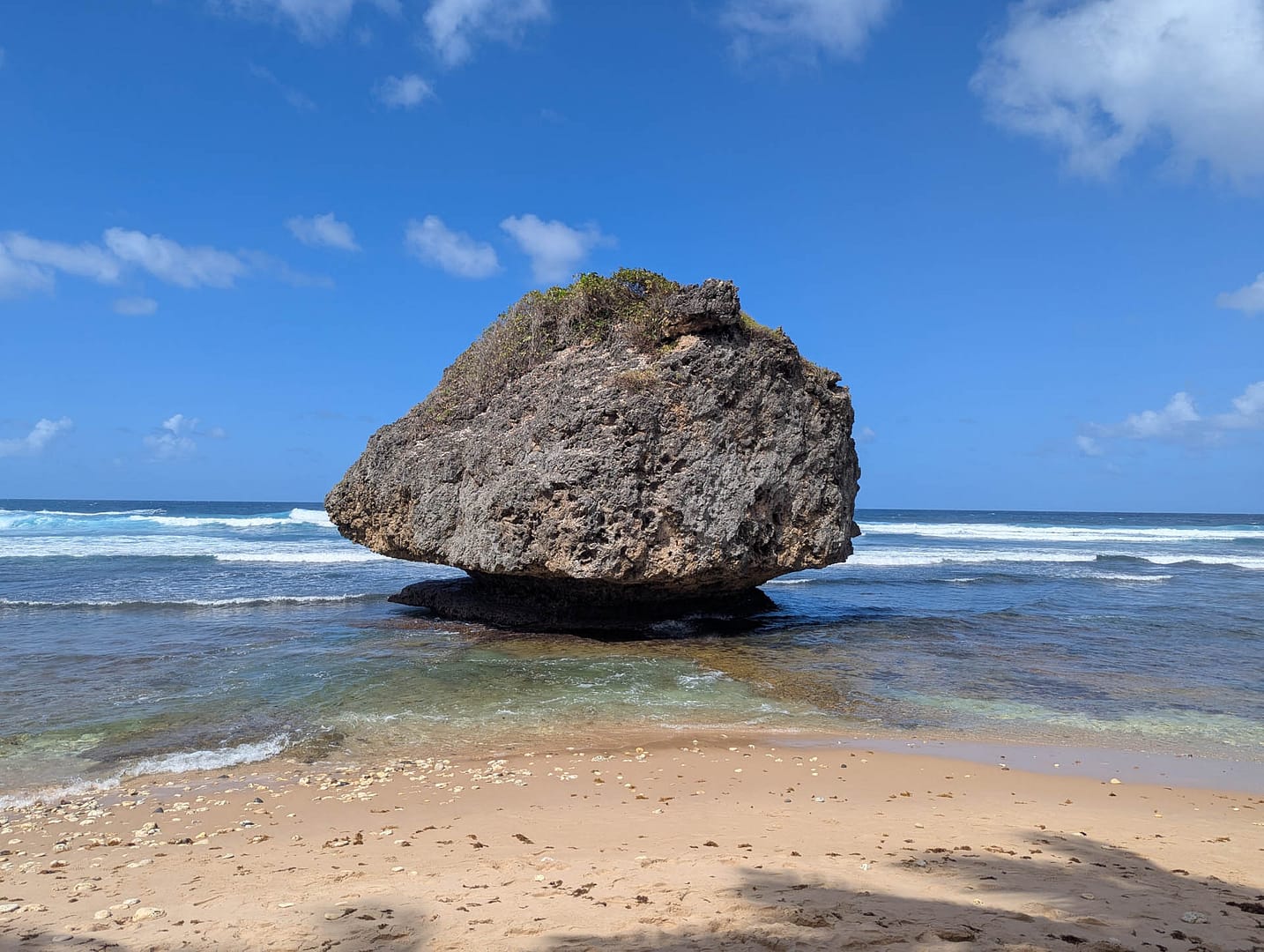 giant rock in surf