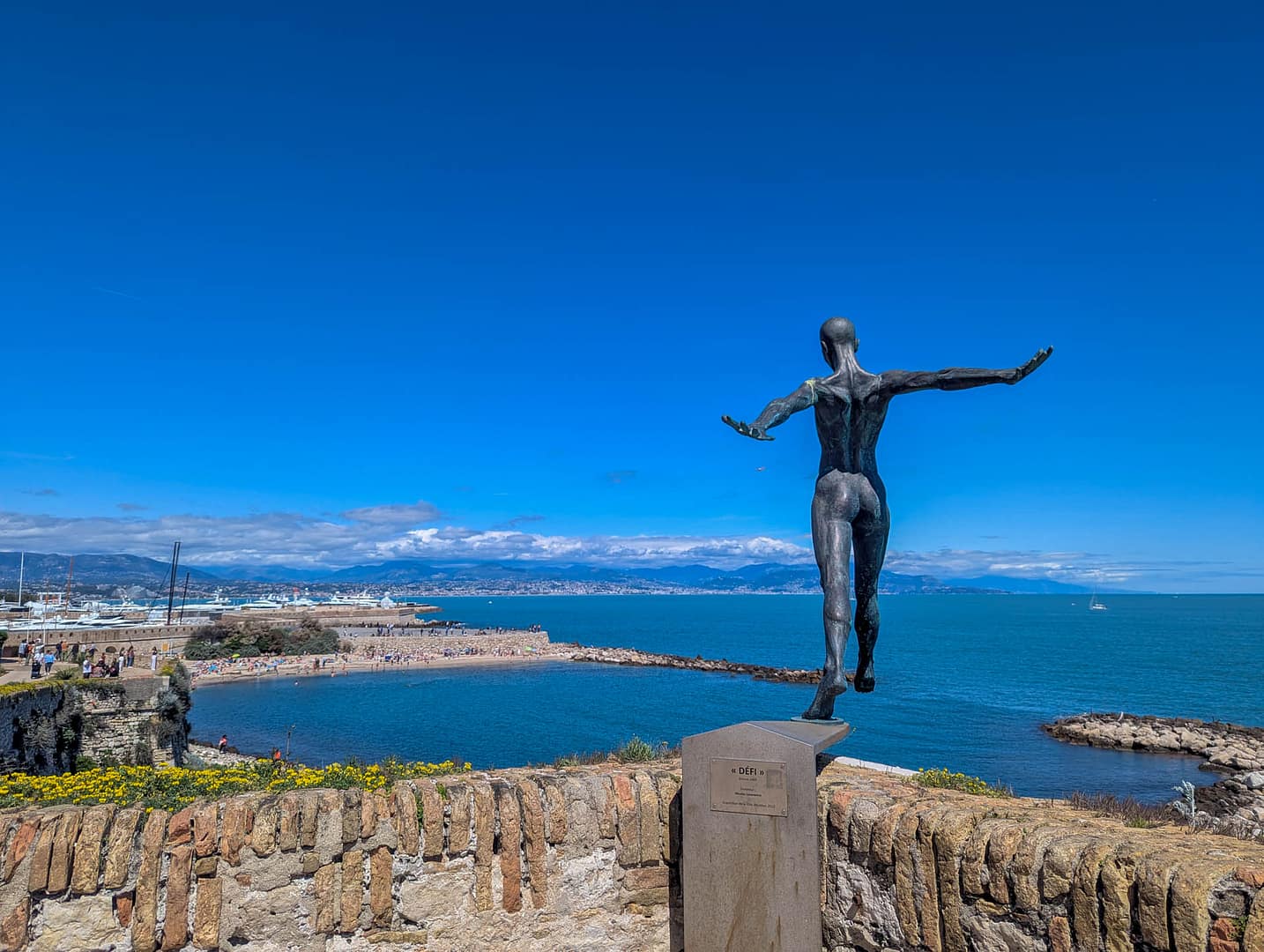 statue stepping off cliff