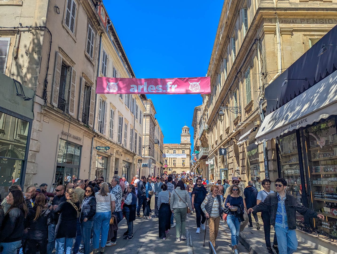 crowded street with banner