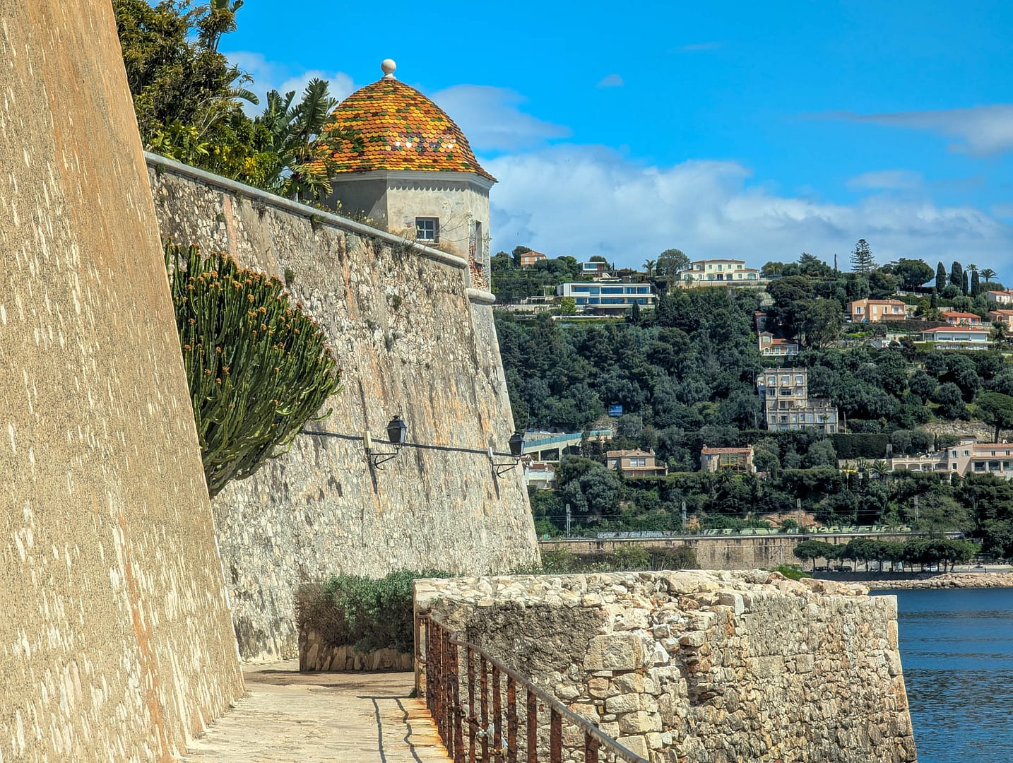 fortress wall with village in background