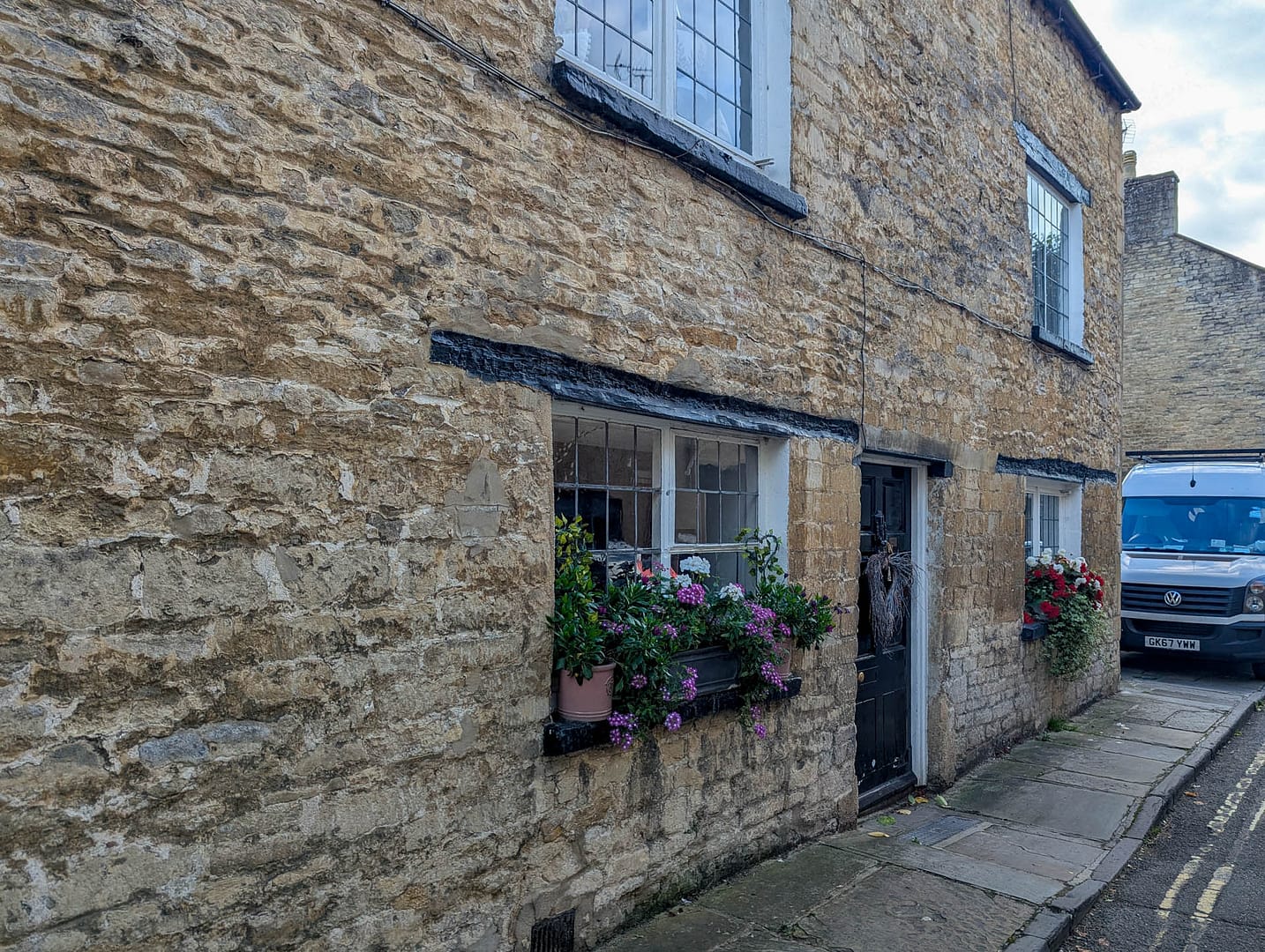 old stone building with window box