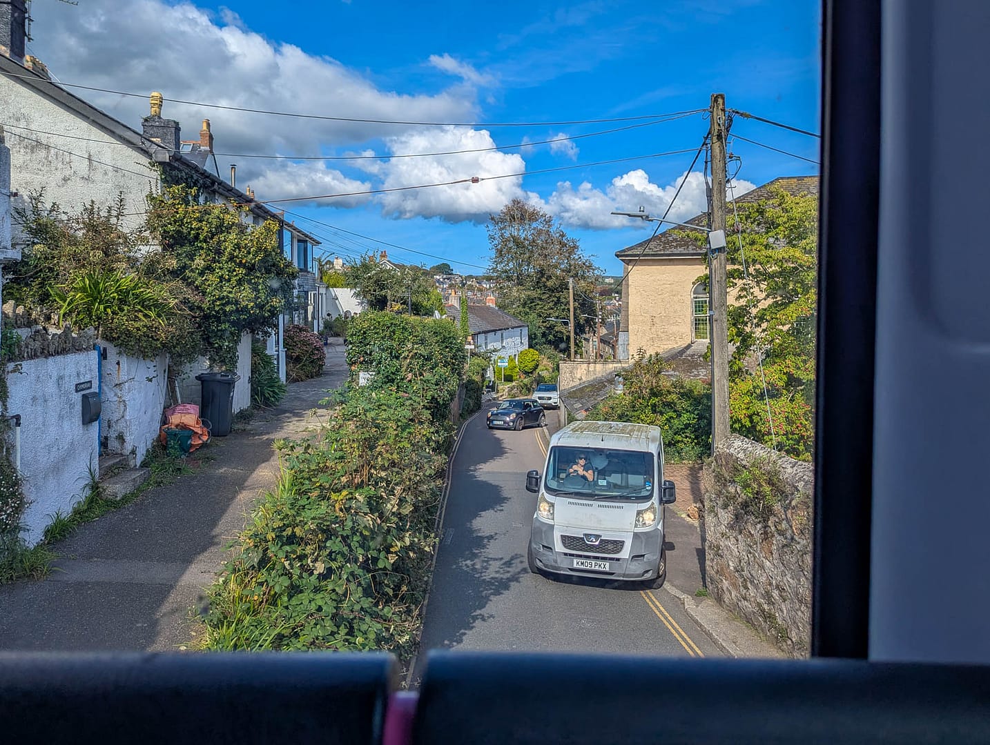 narrow street with vehicle