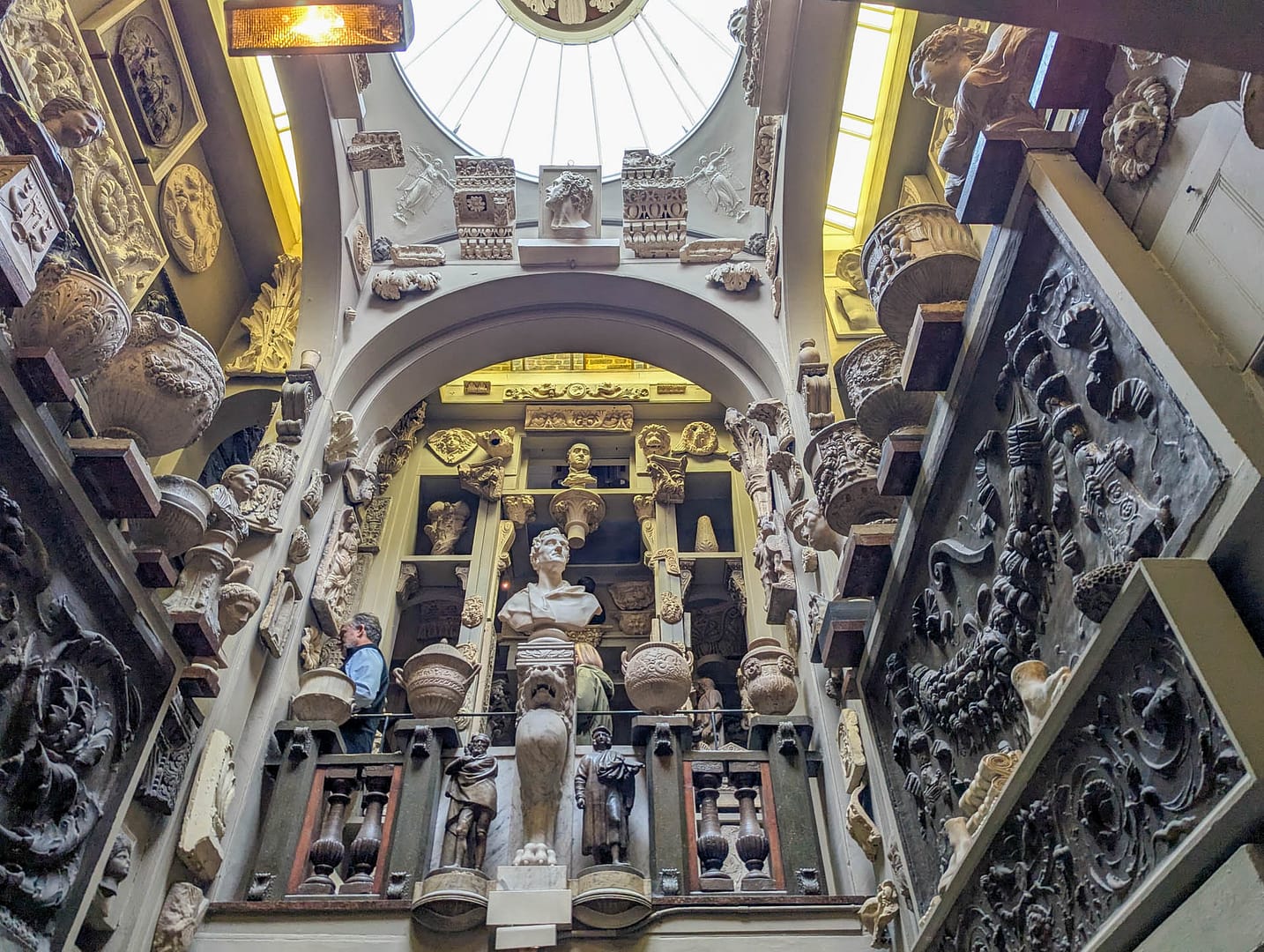 statue on balcony viewed from below