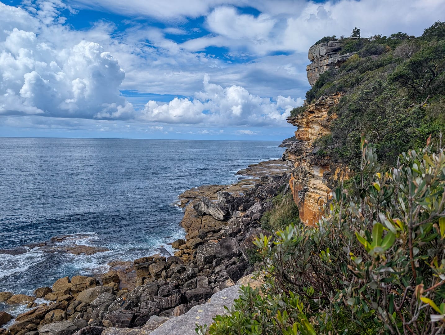 rocky cliff into ocean
