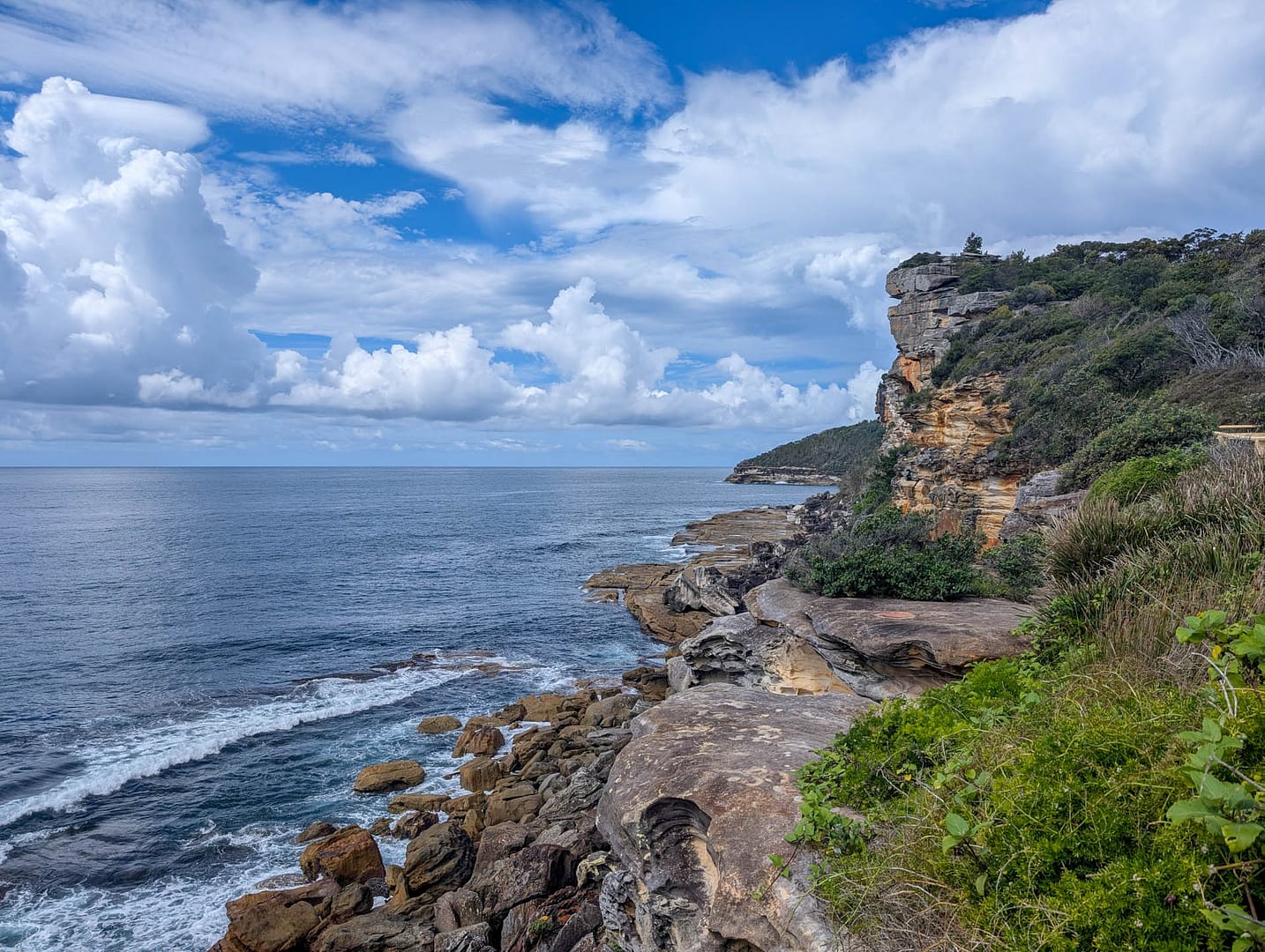 rocky cliff into water