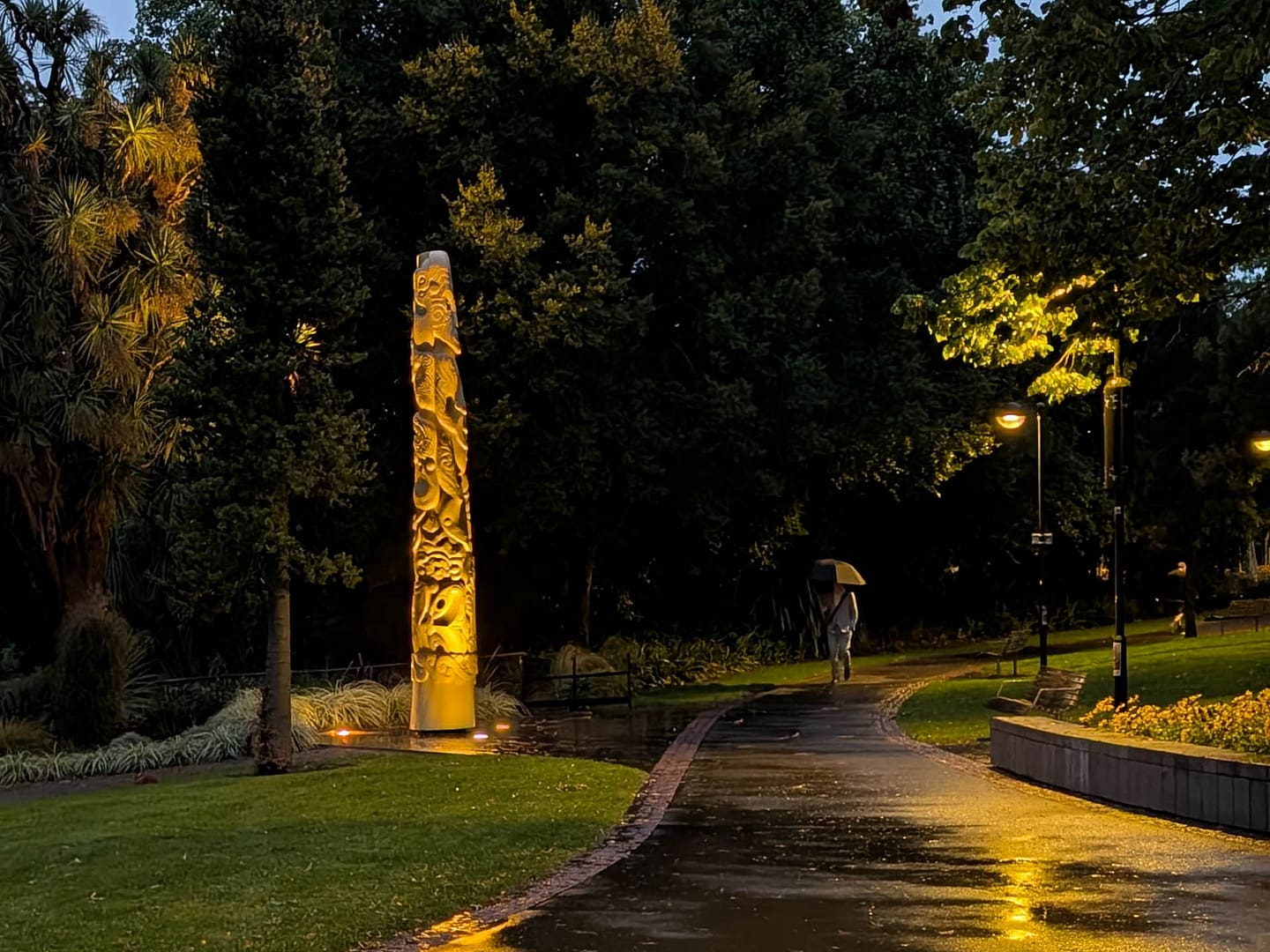 Maori wooden post at night
