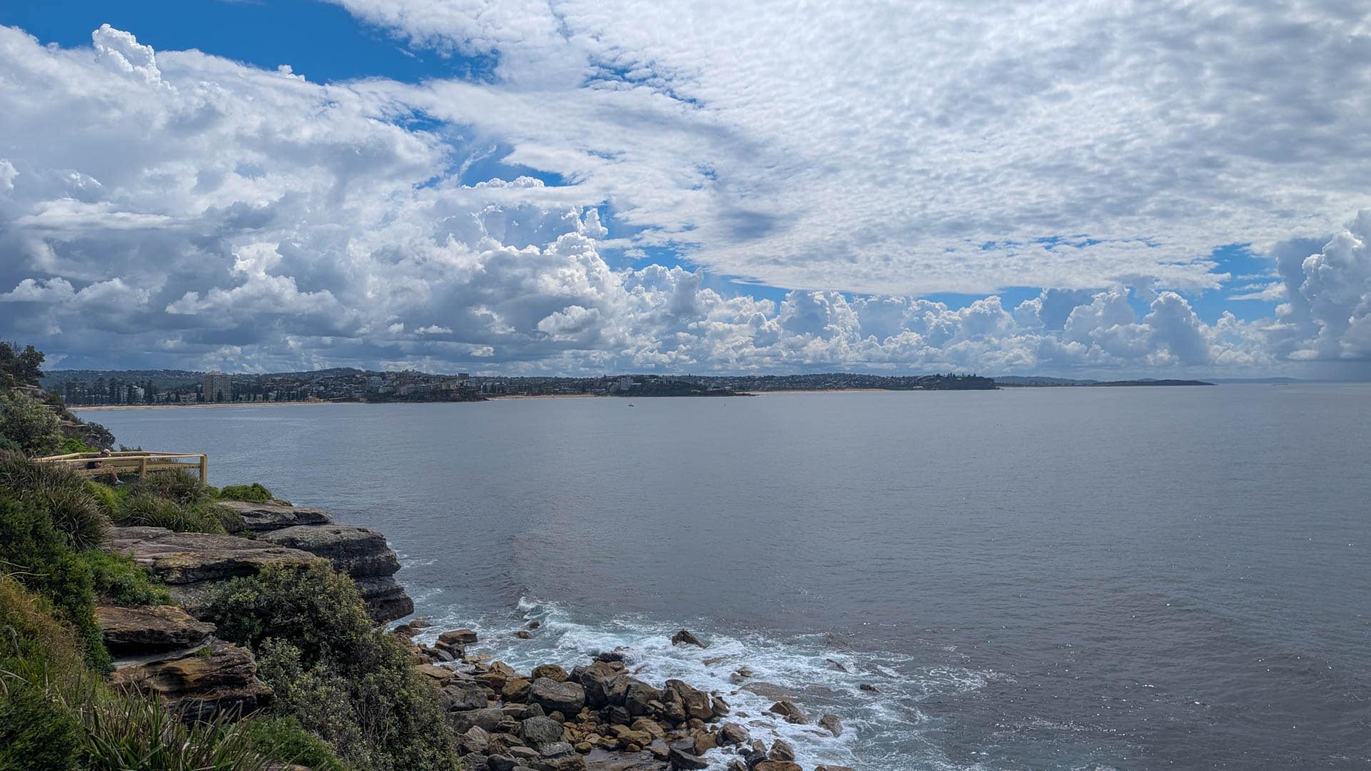 view from cliff across bay