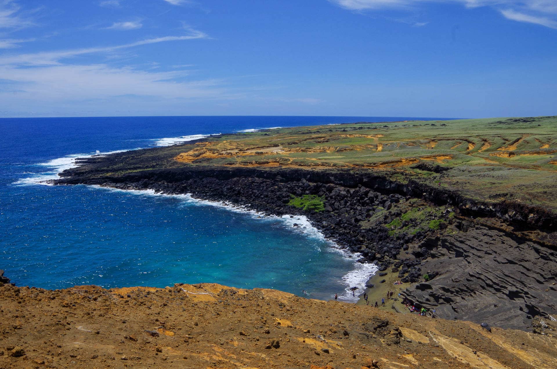 green sand beach from cliff top
