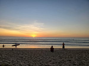 Playa Grande sunset with surfer