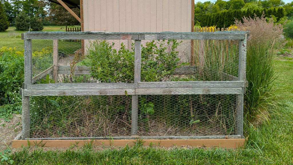 cage of old wood and chicken wire