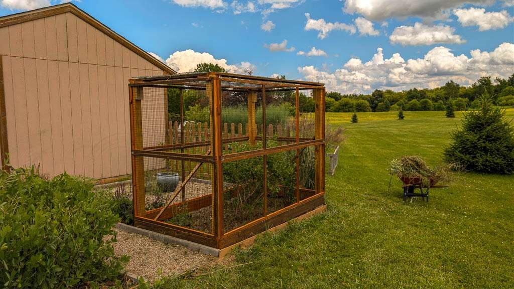 cage of wood and deer netting