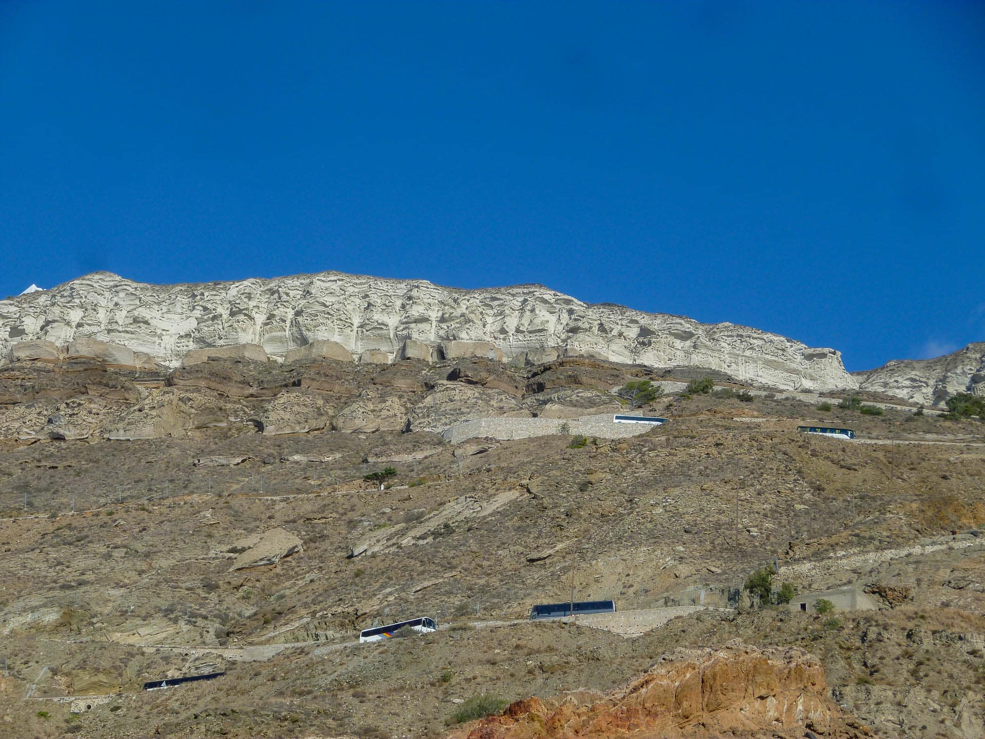 busses traveling a cliff