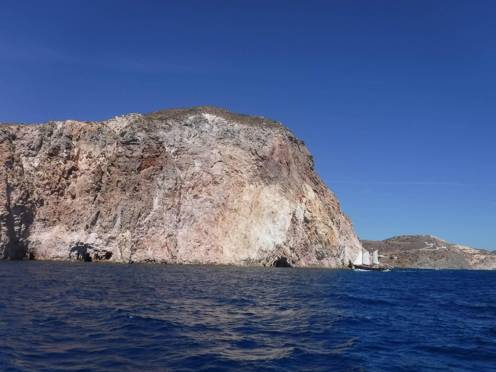 headland and sailboat
