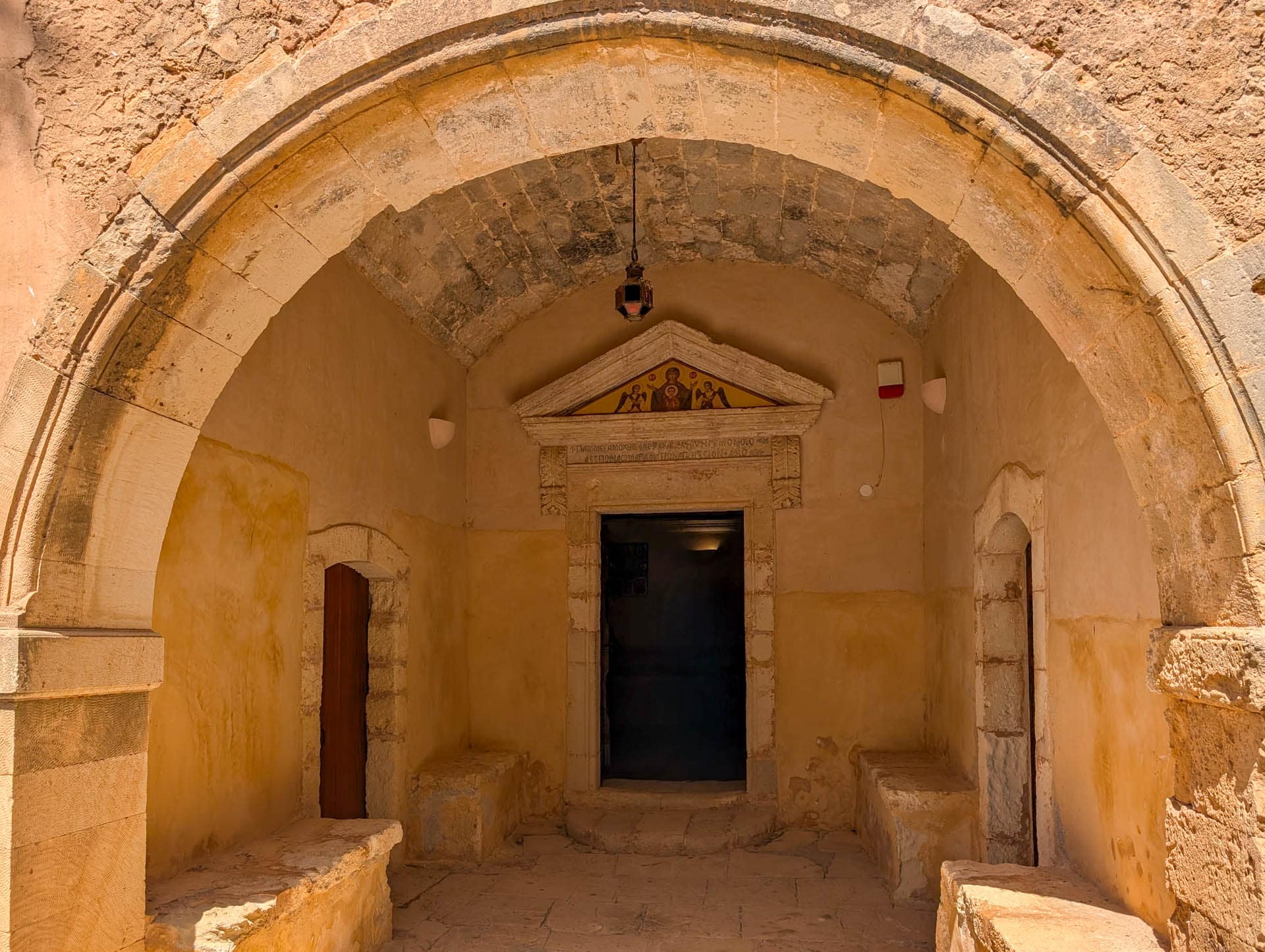arched niche with door and painting