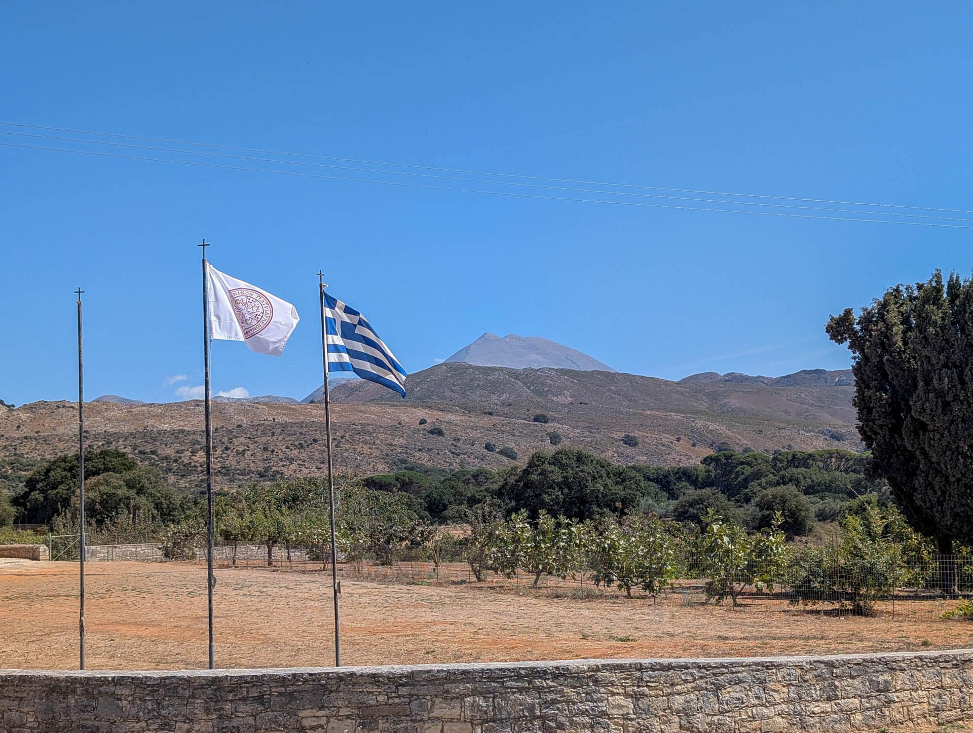 Greek flag with mountain in background