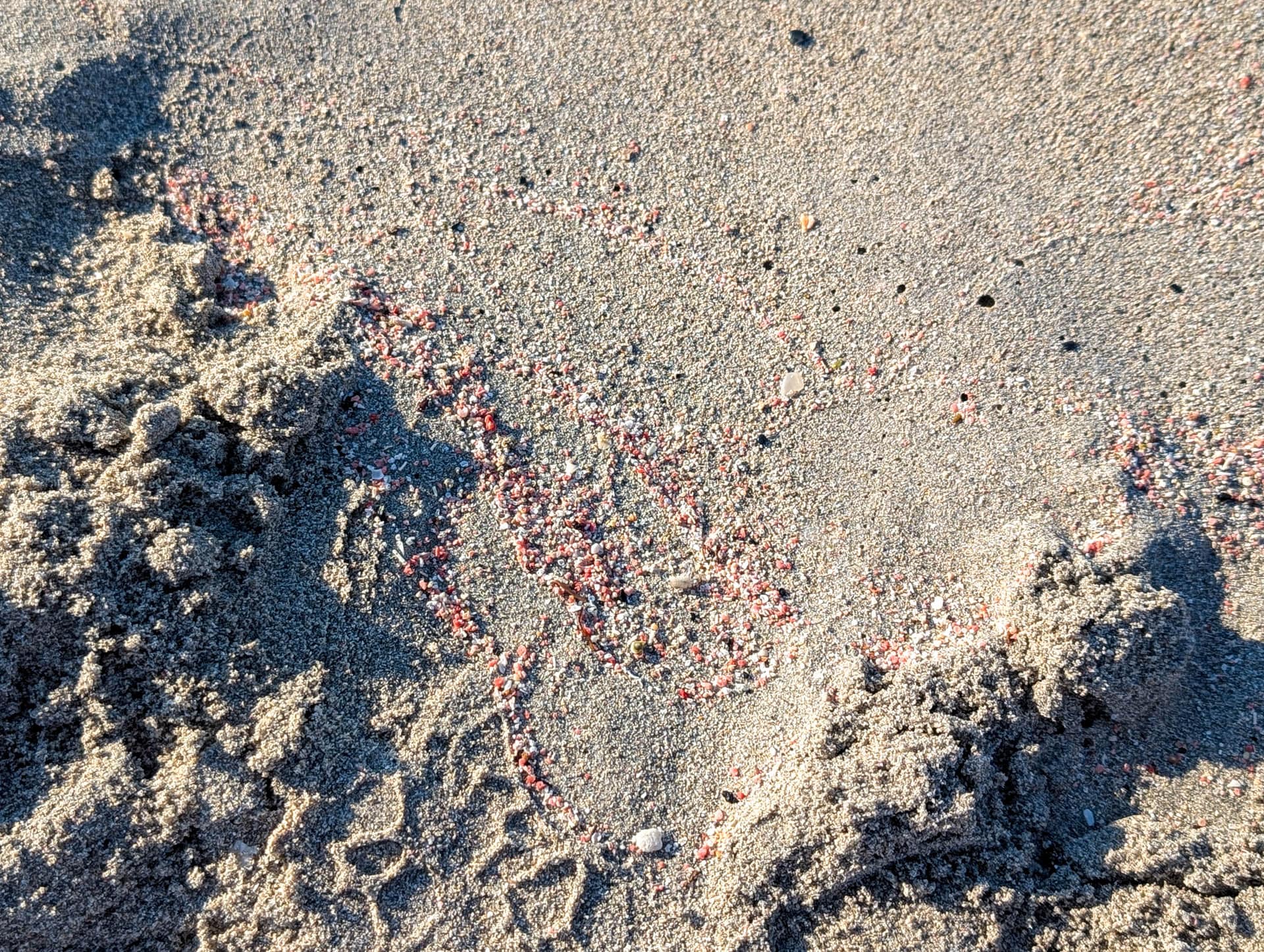pink sand mixed with white