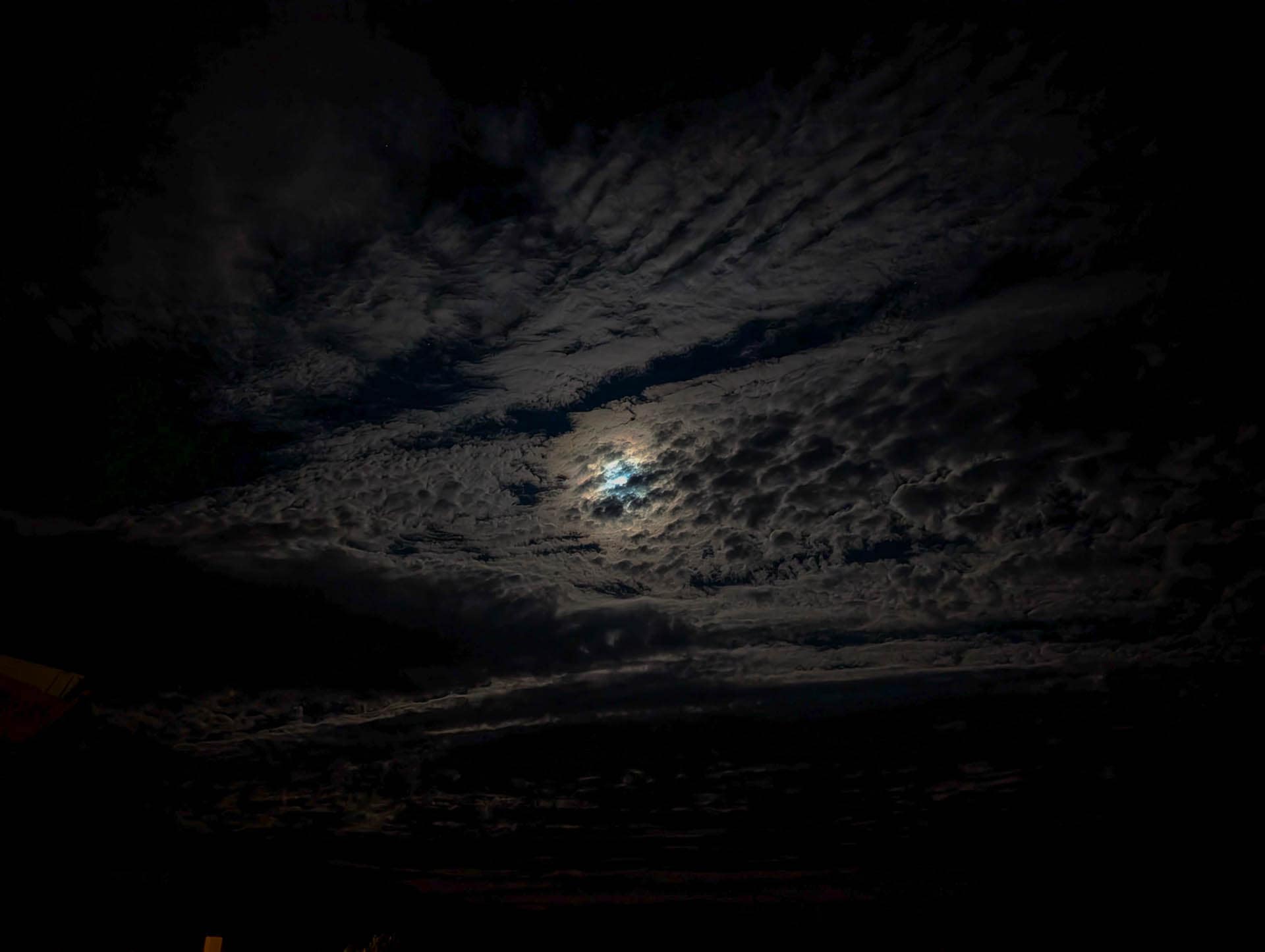 moon behind clouds