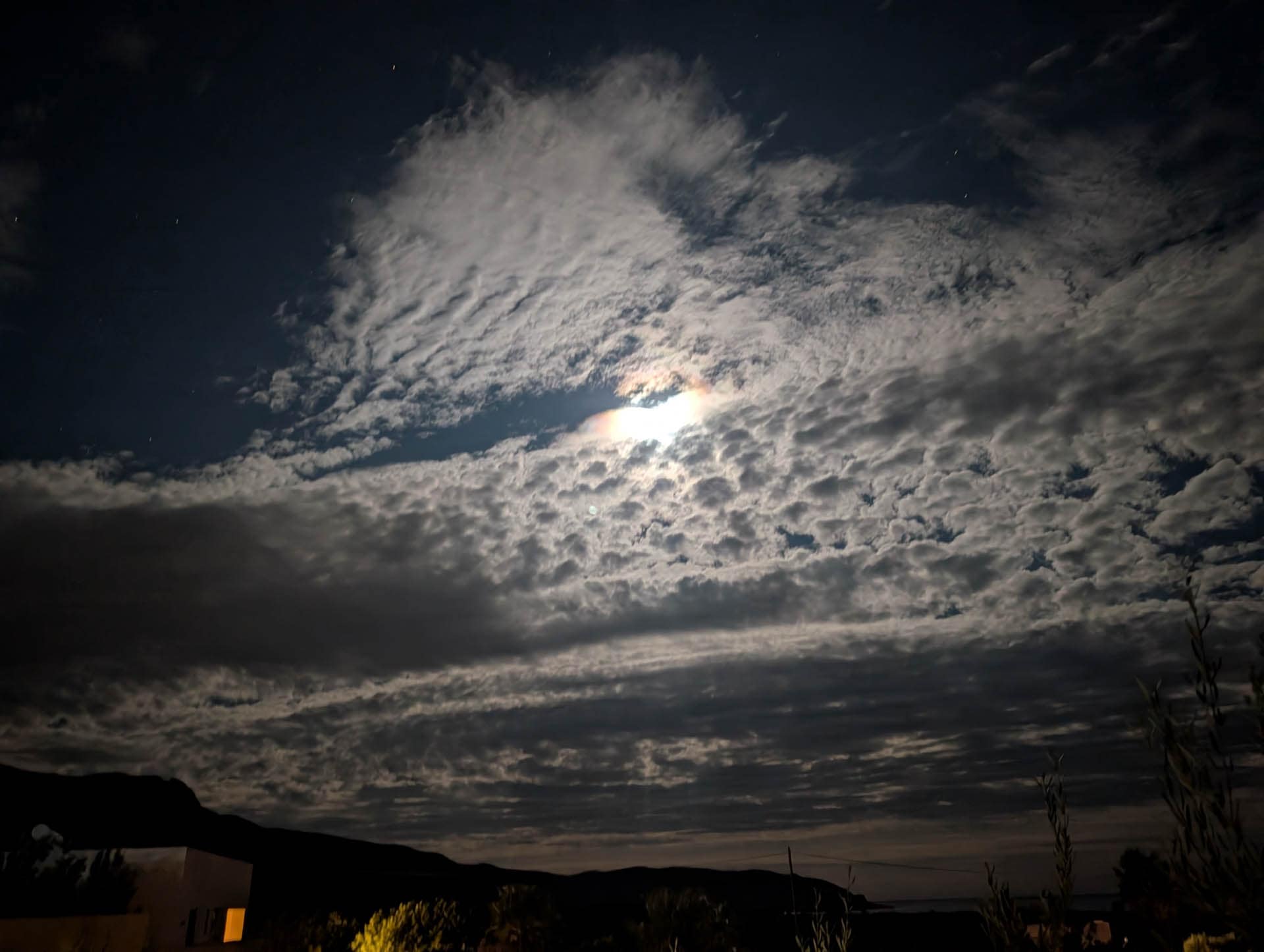 moon behind clouds