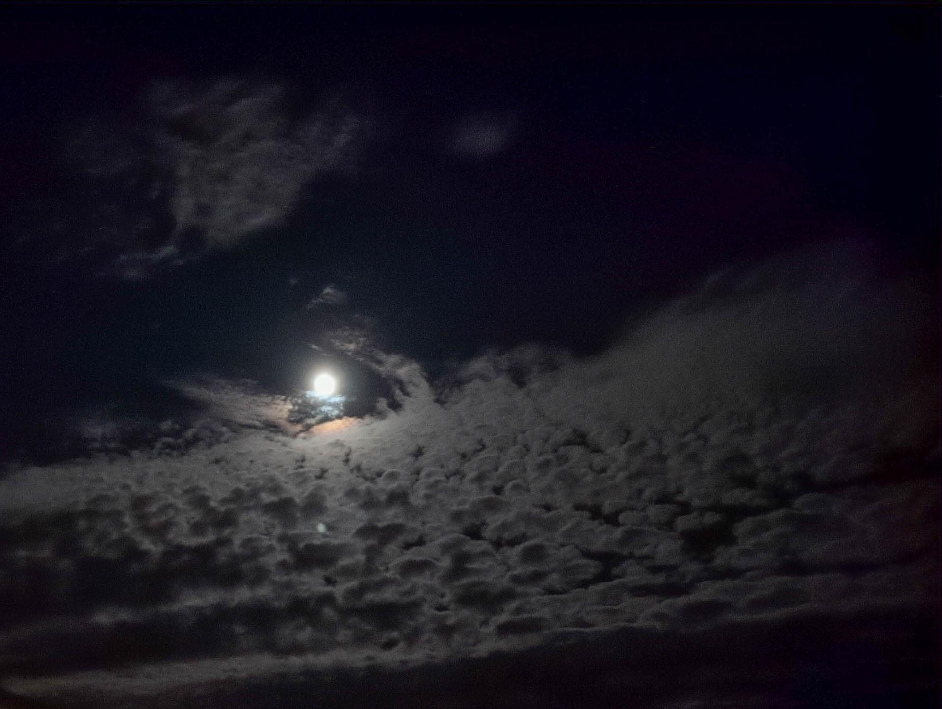 moon behind clouds