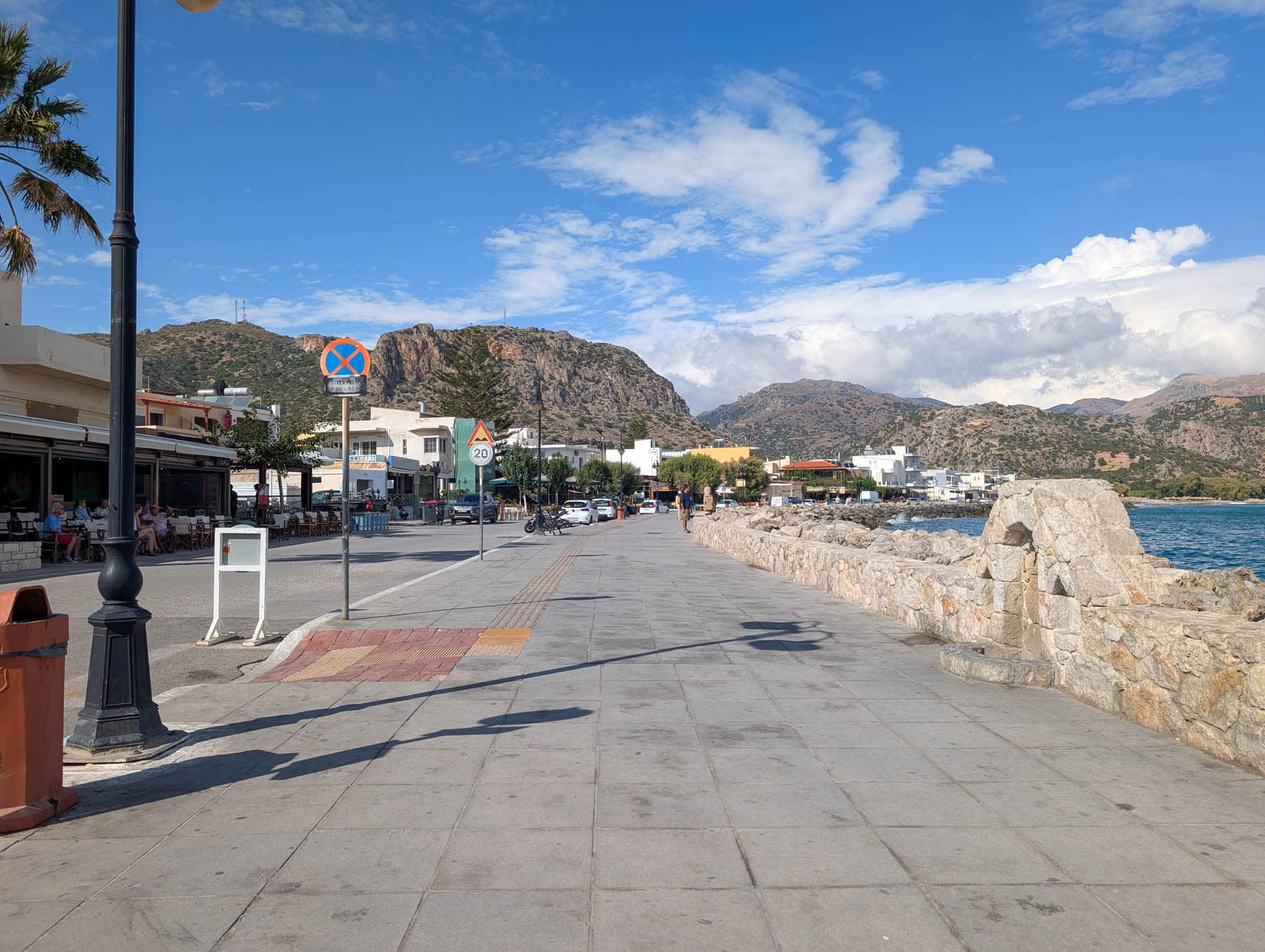 town along shore with mountains behind