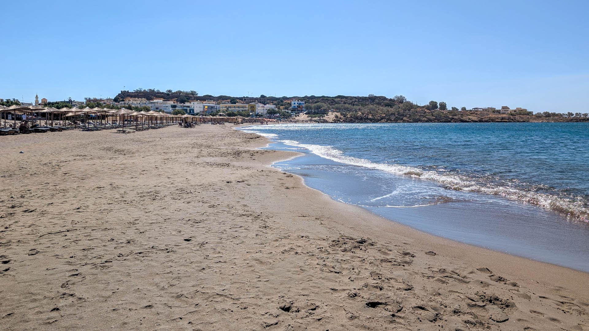 beach with headland in distance