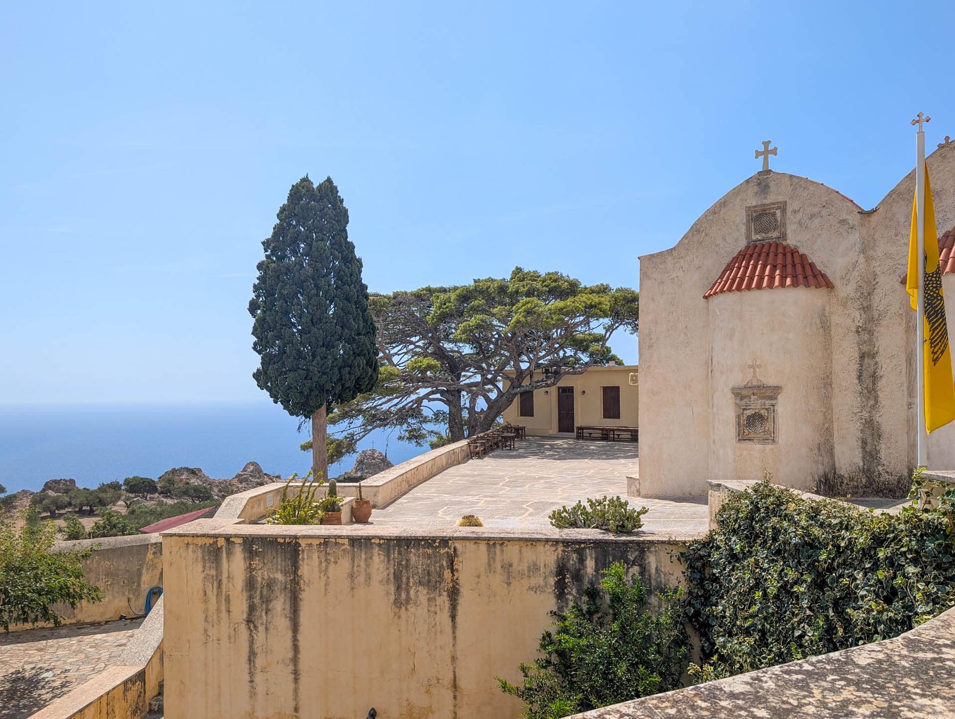 church and courtyard with water view