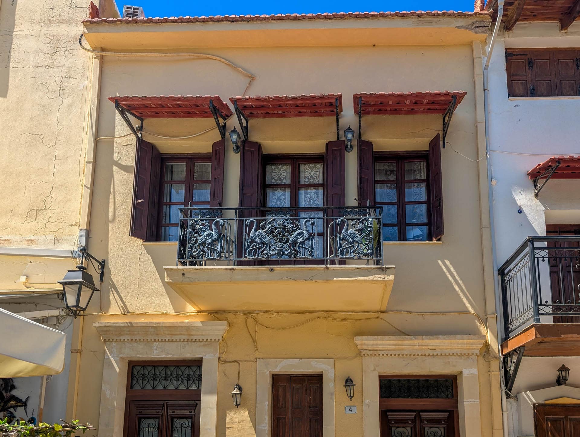 metal balcony railing with birds