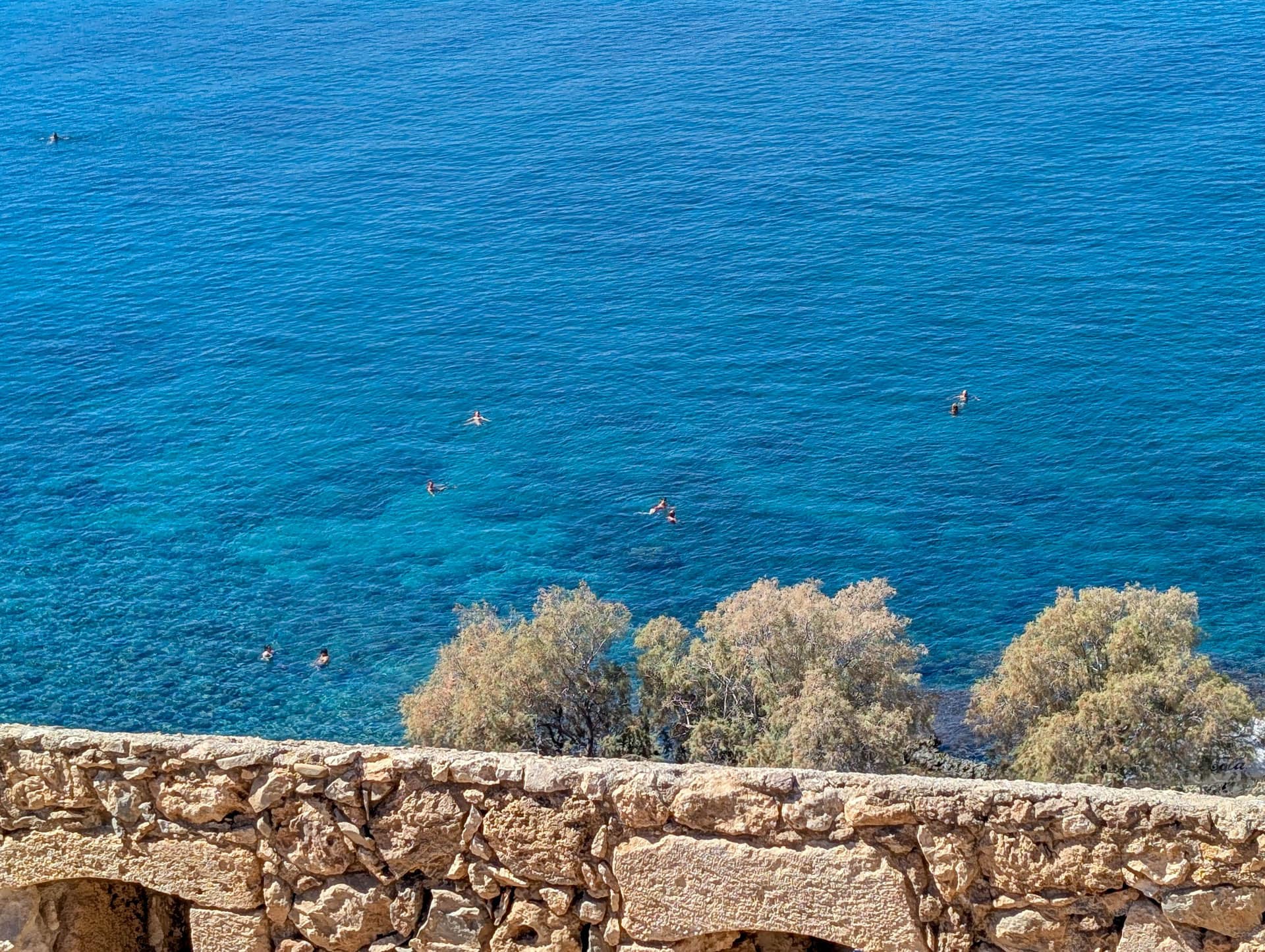 swimmers near fortress