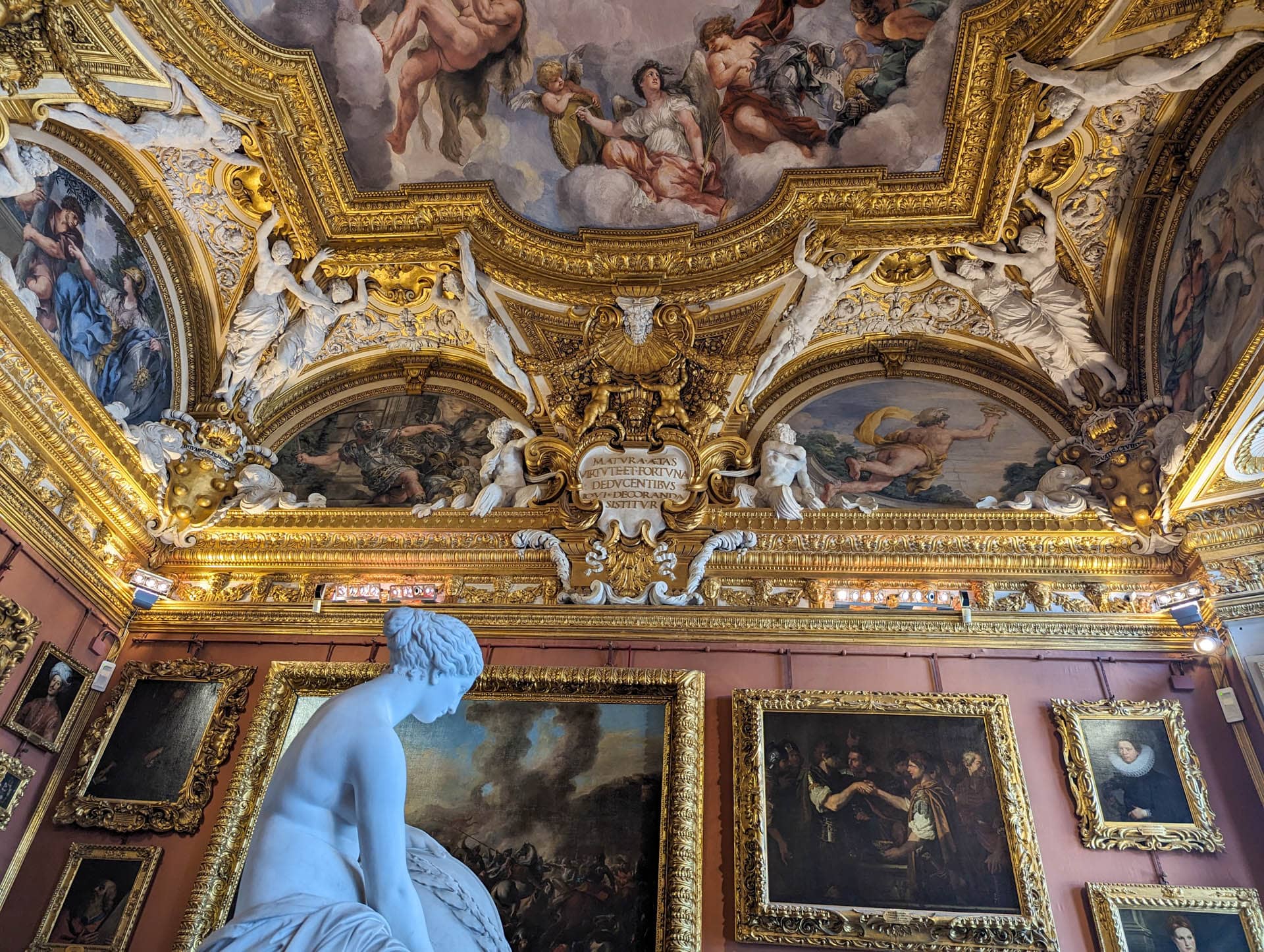 statue against elaborate ceiling